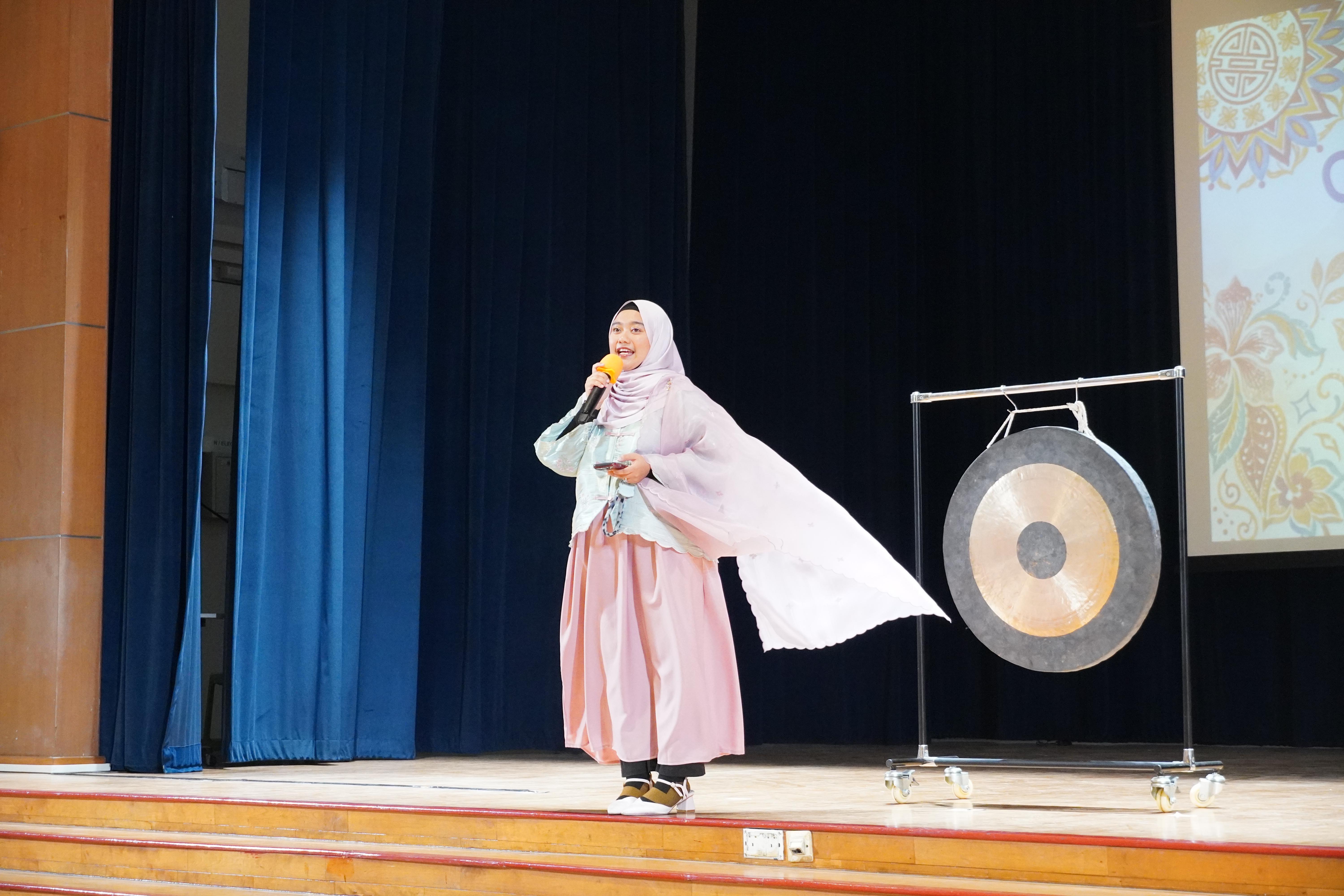 All eyes on the stage as our emcee brings her energy and enthusiasm to kick off the festivities.